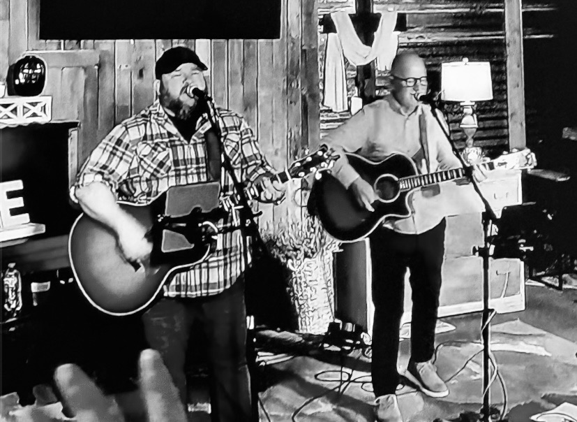 Danny Dukes performing an acoustic set with another guitarist